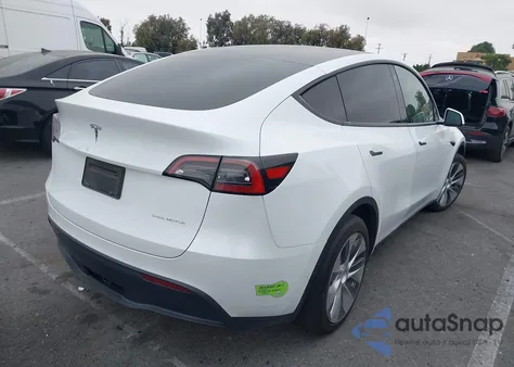 2023 Tesla Model Y Awd/Long Range Dual Motor All-Wheel Drive z USA, uszkodzony, nr VIN 7SAYGAEEXPF582955